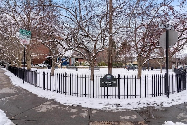 snow covered gate with fence