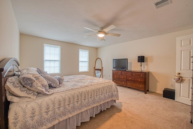 227 Village St, Millis, MA 02054 - bedroom with light carpet, baseboards, visible vents, and a ceiling fan