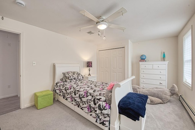 227 Village St, Millis, MA 02054 - carpeted bedroom featuring a baseboard radiator, multiple windows, visible vents, and a closet
