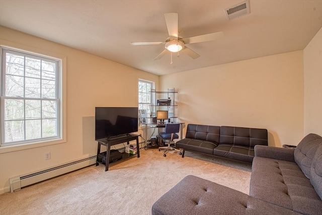 227 Village St, Millis, MA 02054 - carpeted living room with a baseboard radiator, visible vents, and a ceiling fan