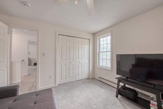 227 Village St, Millis, MA 02054 - living area with carpet, baseboards, ceiling fan, and baseboard heating