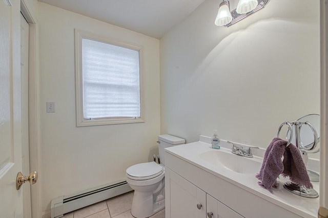 227 Village St, Millis, MA 02054 - bathroom with a baseboard heating unit, vanity, toilet, and tile patterned floors