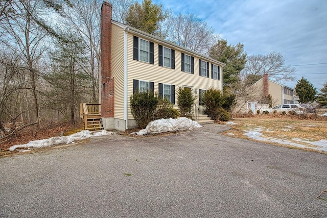 227 Village St, Millis, MA 02054 - colonial inspired home featuring a chimney