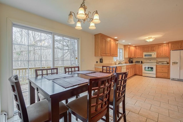 227 Village St, Millis, MA 02054 - dining room with light tile patterned floors, a chandelier, and recessed lighting