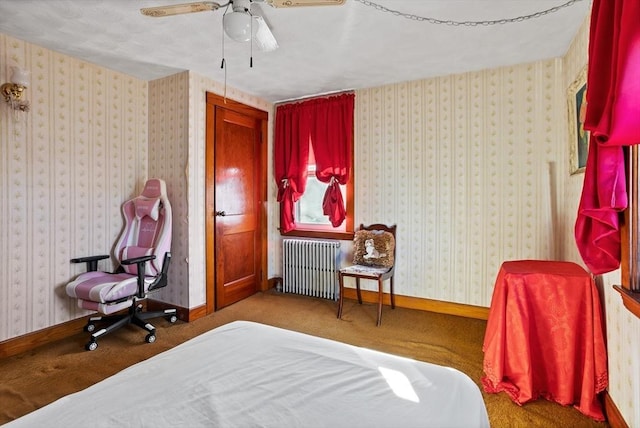 bedroom with carpet flooring, ceiling fan, and radiator