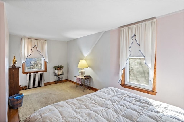 carpeted bedroom featuring radiator