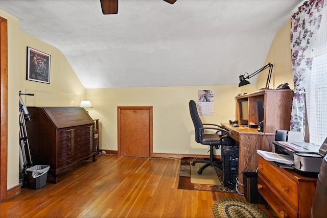 office featuring light wood-type flooring and lofted ceiling