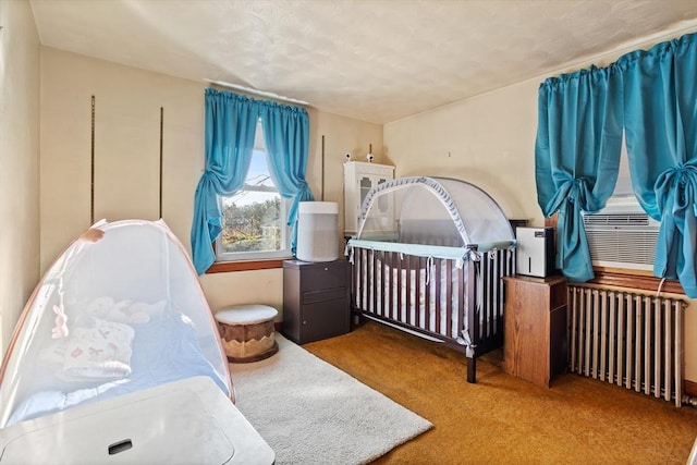 bedroom featuring carpet flooring and radiator heating unit