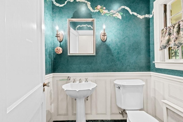 25 Hundreds Cir, Wellesley, MA 02481 - half bathroom with toilet, wainscoting, a decorative wall, and a sink