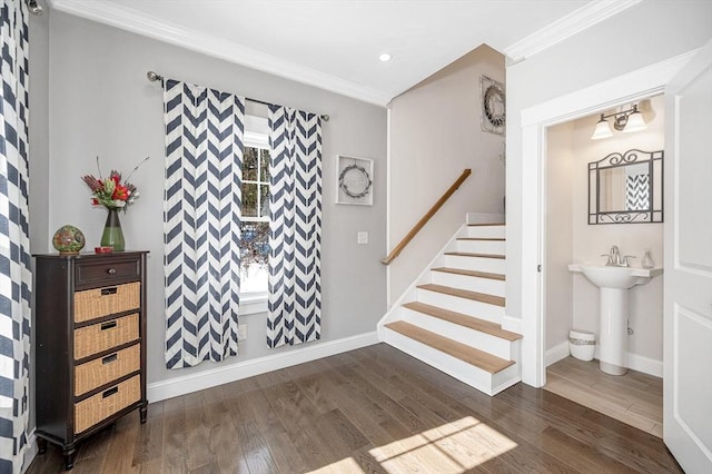 entrance foyer with dark wood-style flooring, crown molding, recessed lighting, stairway, and baseboards