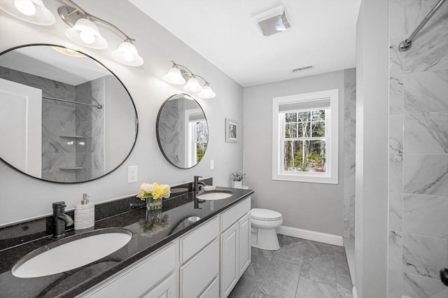 bathroom featuring marble finish floor, double vanity, visible vents, toilet, and a sink