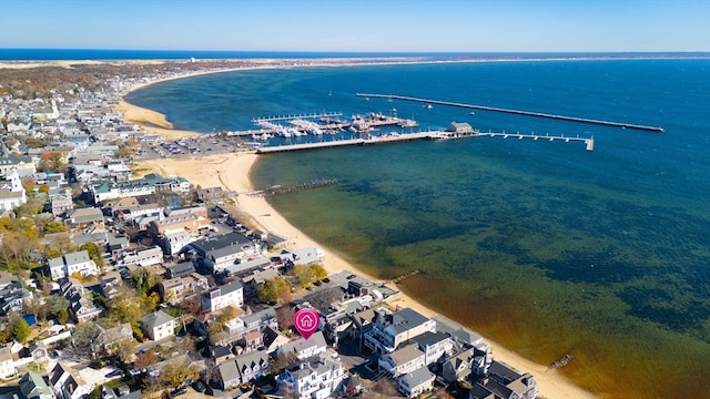 birds eye view of property with a water view and a view of the beach