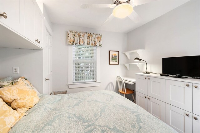 bedroom with ceiling fan and a closet