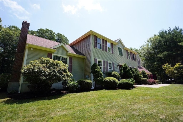 42 Wall St, Middleboro, MA 02346 - colonial house with a front lawn and a chimney