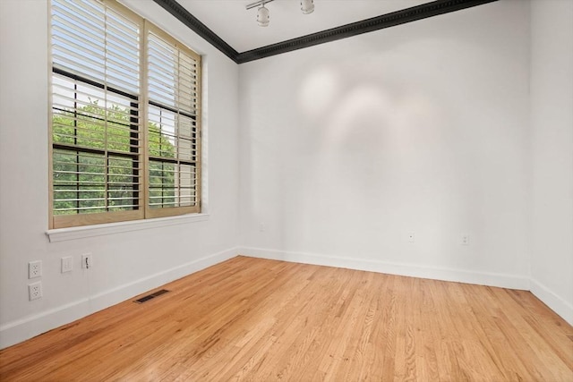 227 Summit Unit W207, Brookline, MA 02446 - spare room with baseboards, ornamental molding, and wood finished floors