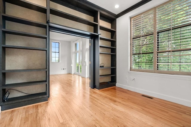 227 Summit Unit W207, Brookline, MA 02446 - unfurnished room featuring baseboards, wood finished floors, and healthy amount of natural light