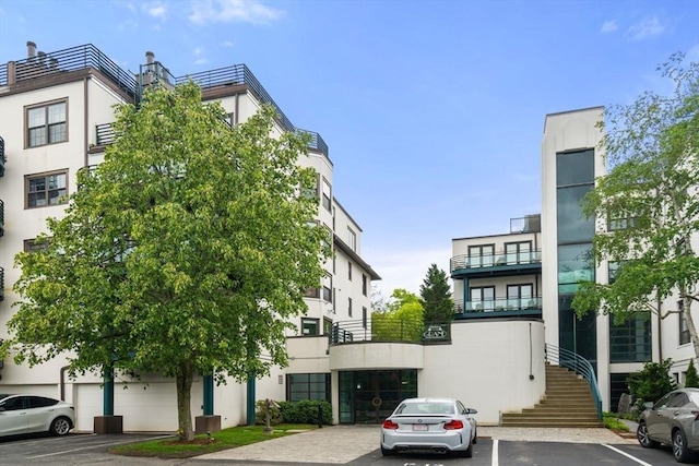 227 Summit Unit W207, Brookline, MA 02446 - view of property featuring uncovered parking and stairway