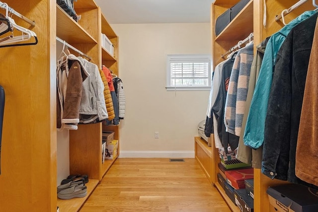 walk in closet featuring light wood-style floors