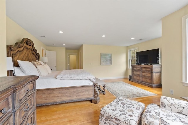bedroom with light wood-style flooring, recessed lighting, and baseboards