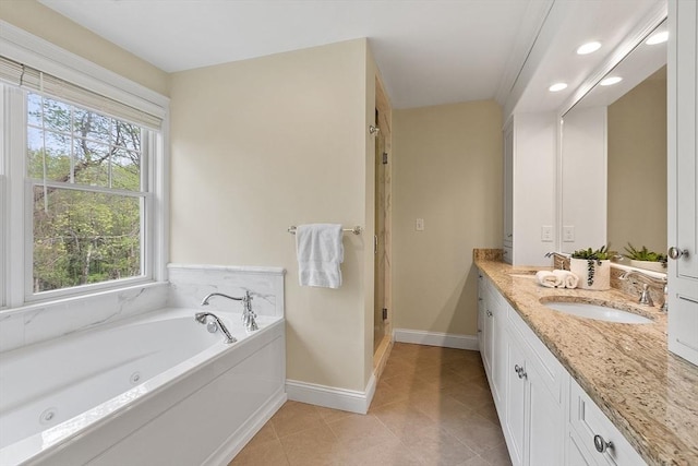 full bathroom with baseboards, healthy amount of natural light, a stall shower, and recessed lighting