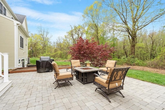view of patio / terrace featuring a fire pit