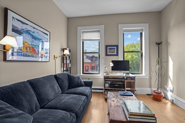 258 Shawmut Ave Unit 8, Boston, MA 02118 - living room featuring wood finished floors, a baseboard radiator, and baseboards