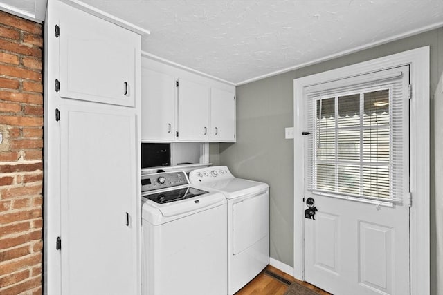 23 Garden Rd, Scituate, MA 02066 - laundry room with cabinet space, washer and dryer, wood finished floors, and a textured ceiling