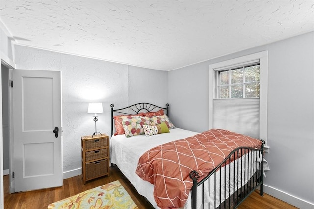 23 Garden Rd, Scituate, MA 02066 - bedroom with a textured ceiling, wood finished floors, and a textured wall