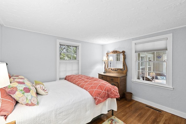 23 Garden Rd, Scituate, MA 02066 - bedroom featuring wood finished floors and a textured ceiling