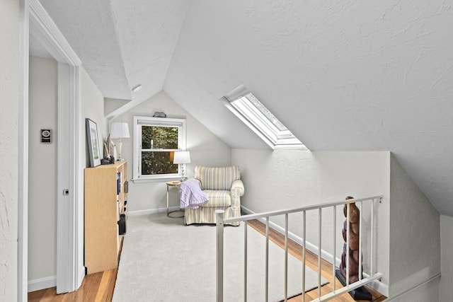 23 Garden Rd, Scituate, MA 02066 - bedroom featuring a textured ceiling, lofted ceiling, a skylight, and wood finished floors