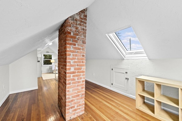 23 Garden Rd, Scituate, MA 02066 - additional living space featuring vaulted ceiling, hardwood / wood-style floors, and a skylight