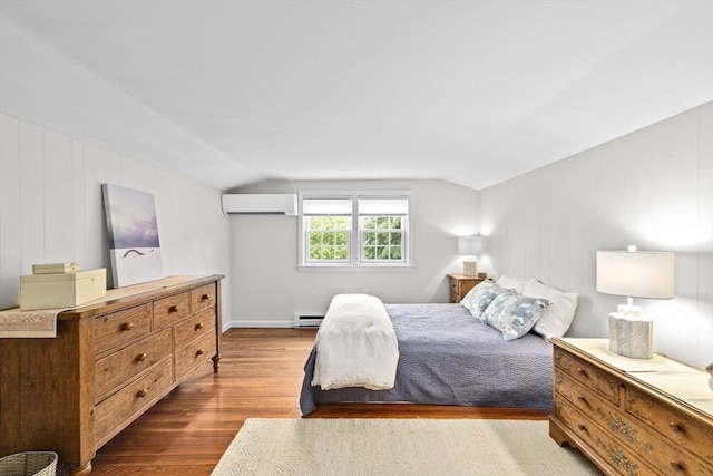 23 Garden Rd, Scituate, MA 02066 - bedroom featuring a wall mounted air conditioner, wood finished floors, a baseboard heating unit, and vaulted ceiling