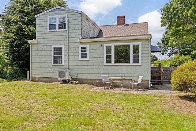 23 Garden Rd, Scituate, MA 02066 - rear view of property featuring a chimney and roof with shingles