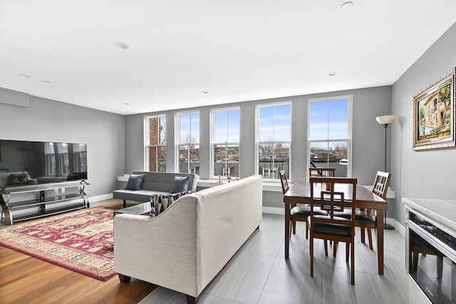 living room featuring recessed lighting and baseboards