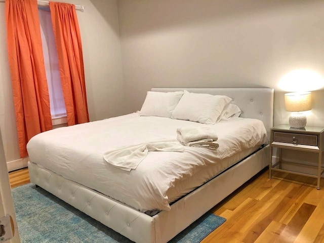 bedroom featuring wood finished floors