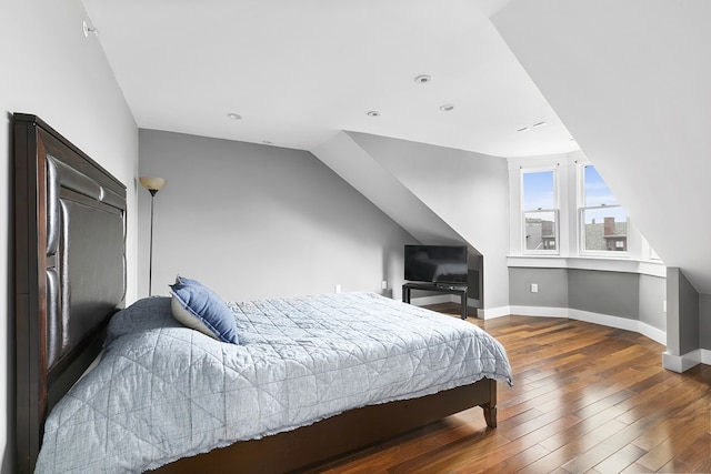 bedroom with hardwood / wood-style floors, lofted ceiling, recessed lighting, and baseboards