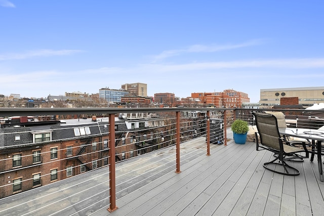 wooden deck with a city view