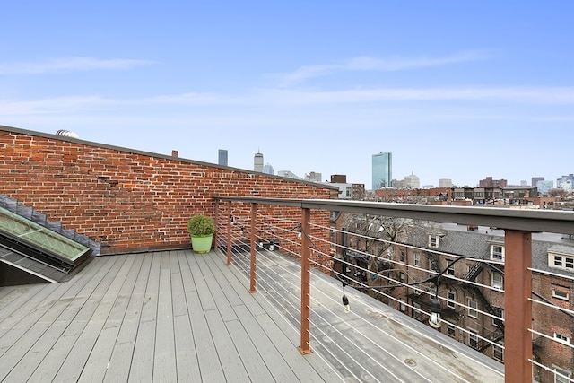 wooden deck featuring a city view