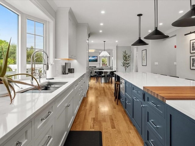 10 Beech St, Millis, MA 02054 - kitchen featuring a sink, healthy amount of natural light, light wood-type flooring, and recessed lighting