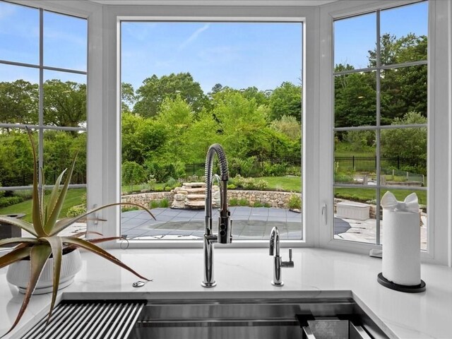 10 Beech St, Millis, MA 02054 - kitchen view of a sink and a tree filled landscape