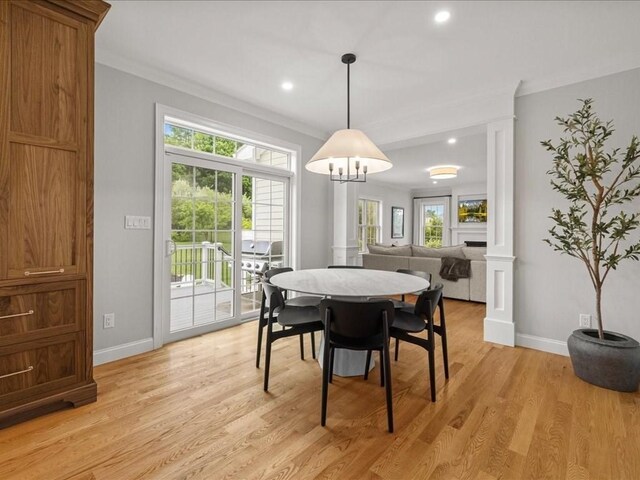 10 Beech St, Millis, MA 02054 - dining space featuring crown molding, baseboards, light wood-type flooring, recessed lighting, and decorative columns