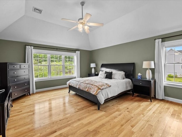 10 Beech St, Millis, MA 02054 - bedroom with vaulted ceiling, multiple windows, light wood-style flooring, baseboards, and a ceiling fan