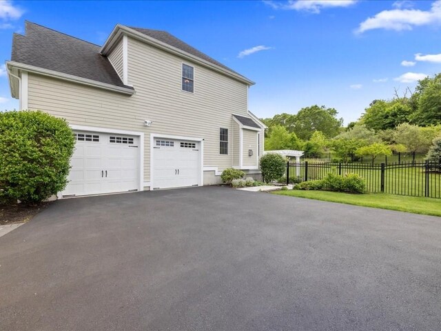 10 Beech St, Millis, MA 02054 - view of side of property featuring driveway and a garage