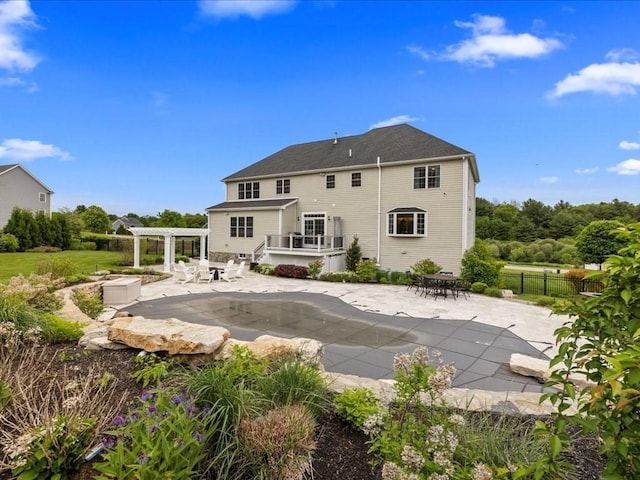 10 Beech St, Millis, MA 02054 - rear view of house featuring a pergola, a patio, outdoor dining area, and a deck