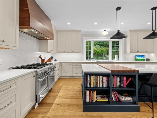 10 Beech St, Millis, MA 02054 - kitchen with range with two ovens, premium range hood, light countertops, open shelves, and recessed lighting