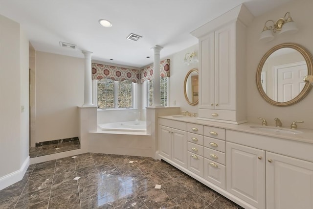 full bath with ornate columns, visible vents, and a sink