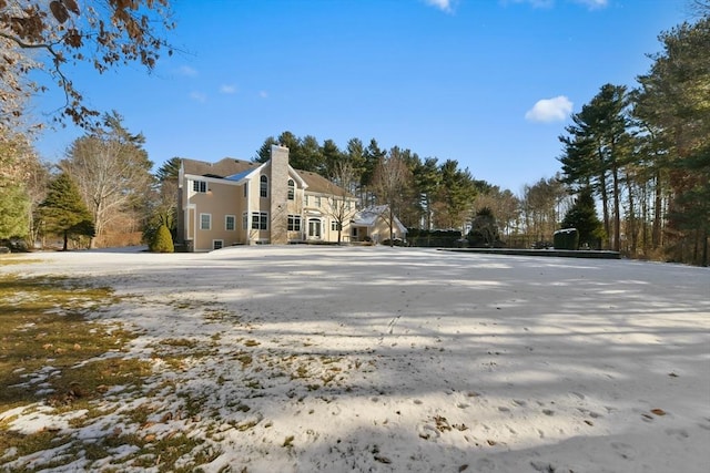 view of side of property with a chimney