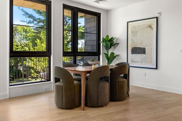 dining space featuring light hardwood / wood-style floors