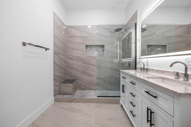 full bathroom featuring a walk in shower, double vanity, marble finish floor, and a sink