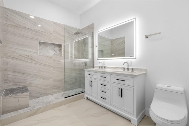 full bathroom featuring a sink, tiled shower, and marble finish floor